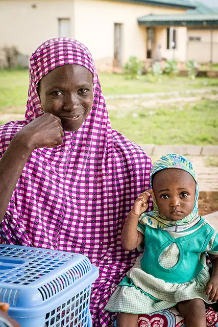 A mother and daughter smile at the camera. Photo by: Melinda Stanley