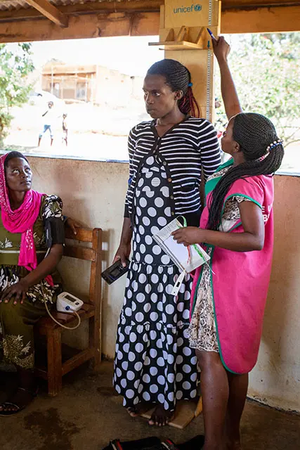 A pregnant woman has her height measured during an ANC visit. Photo by: Melinda Stanley