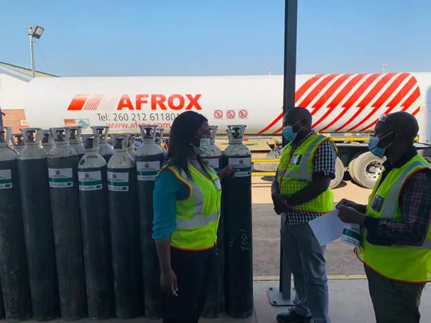 Wide shot of female AFROX staff giving CHAI team a tour of the AFROX facilities
