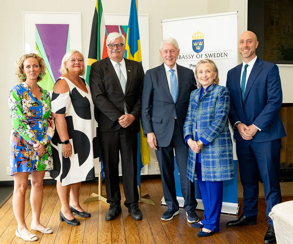 The Ambassador of Sweden and President Bill Clinton pose with colleagues and spouses during an announcement made in Pretoria this week.