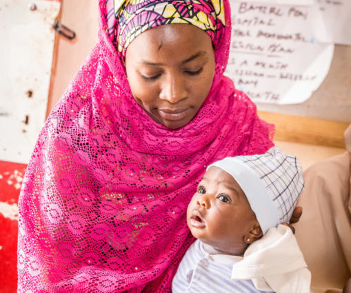 Picture of a mother waiting for her child to be vaccinated