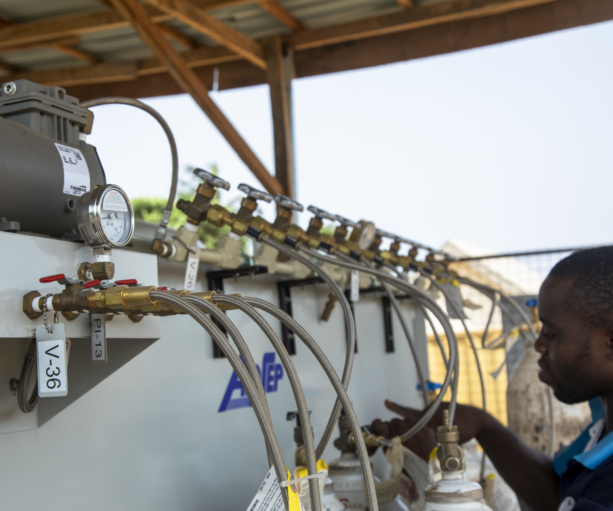 A man checks the equipment at the oxygen plant at Infectious Disease Hospital Yaba, Lagos, Nigeria.