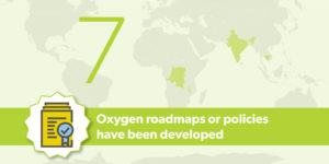 Graphic with green text overlaying world map. Text reads: 7 oxygen roadmaps or policies have been developed.