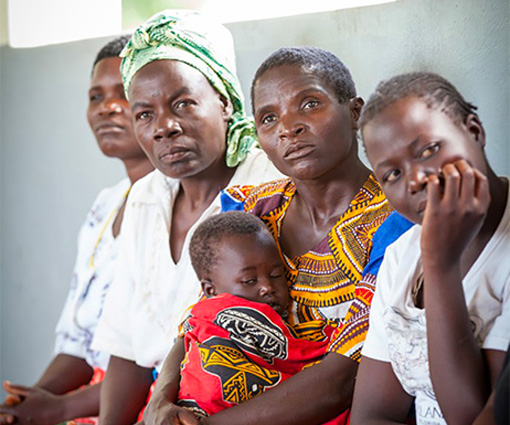 Picture of four women and a baby sitting together