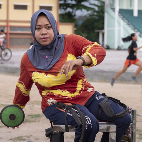 A woman in a wheelchair plays a game. Missing Billion report launched in October.