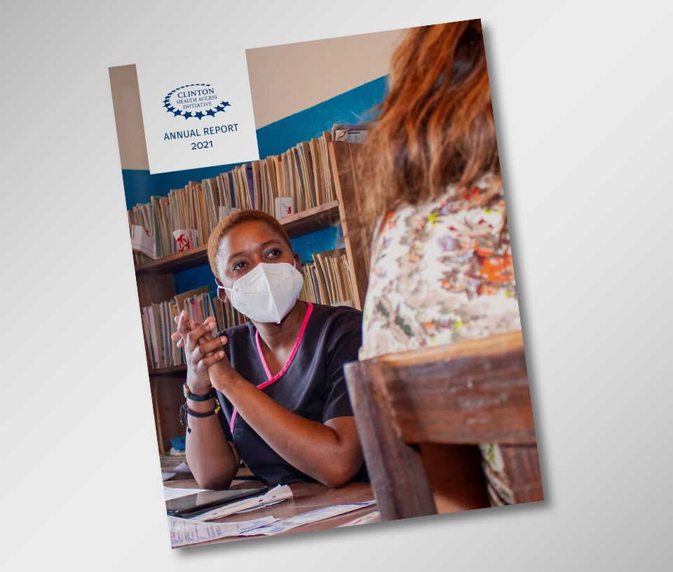 Cover page of CHAI's 2021 Annual Report. Nurse in mask holds hands together while looking at a patient.