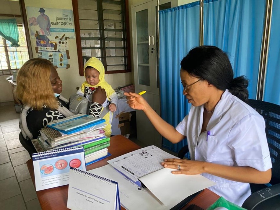 Nurse counseling a woman in a clinic in Nigeria