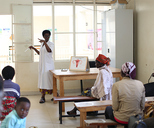 A clinician holds a cervical cancer awareness presentation in Rwanda
