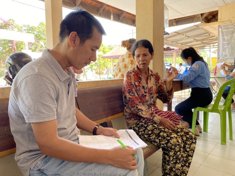 Doctor is having a consultation with elderly woman in Kampot Province, Cambodia