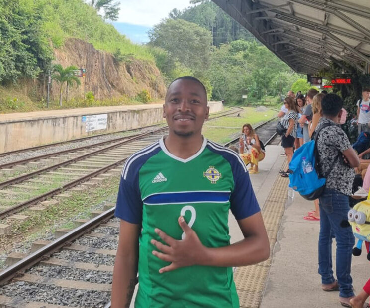 Photo of Refiloe Damane standing on a train platform